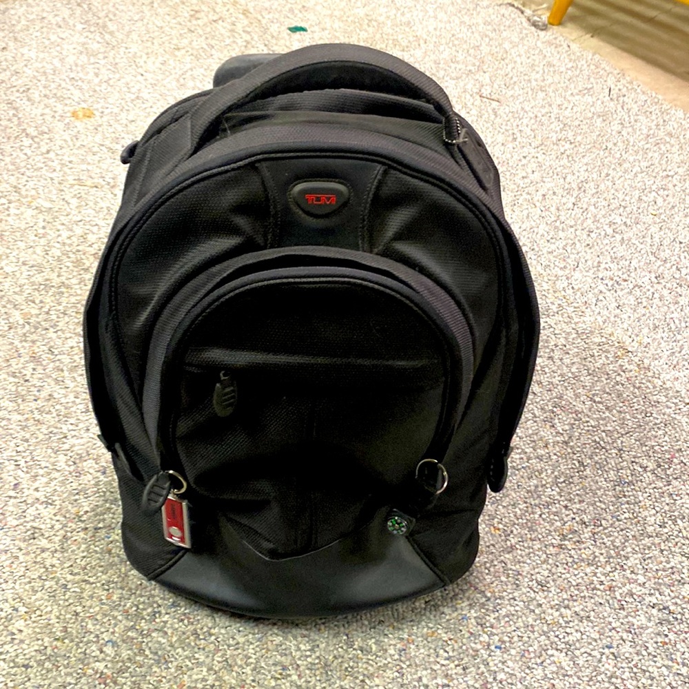 Tumi rolling travel bag with optional backpack straps